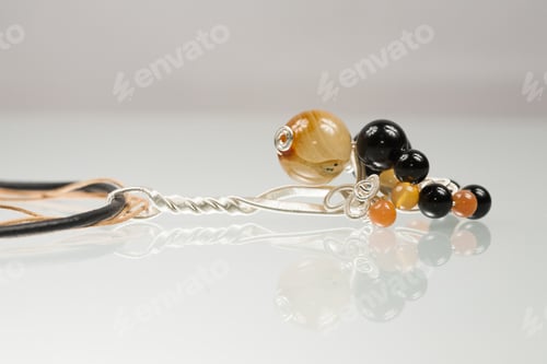 Preview: Handmade Pendant With Agate And Onyx Gemstones And Leather Lace With White Background