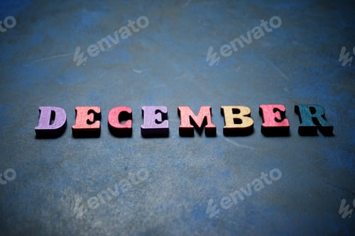 Preview: December Word On A Blue Table.