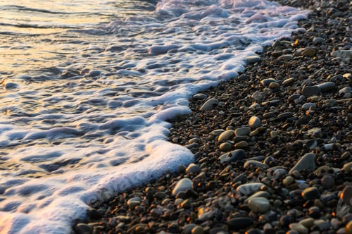 Preview: Sea Pebble Beach With Multicoloured Stones, Transparent Waves With Foam, On A Warm Summer Day