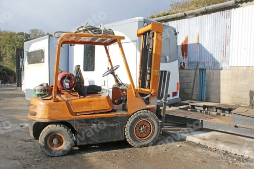 Preview: Yellow Forklift Truck In A Yard