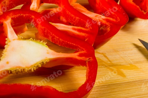 Preview: Sliced Fresh Red Paprika, Bell Pepper On Bamboo Cutting Board