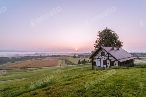 Preview: Beautiful Sunrise By The Medieval House In Rural Countryside Of Slovenia
