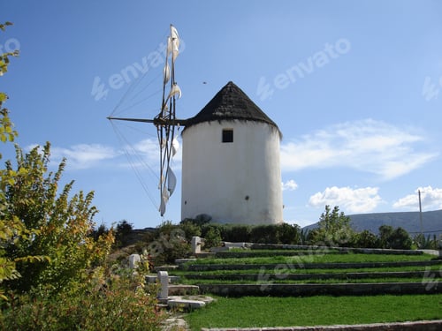 Preview: Photo Of Traditional Greek Windmill Located In A Cycladic Island