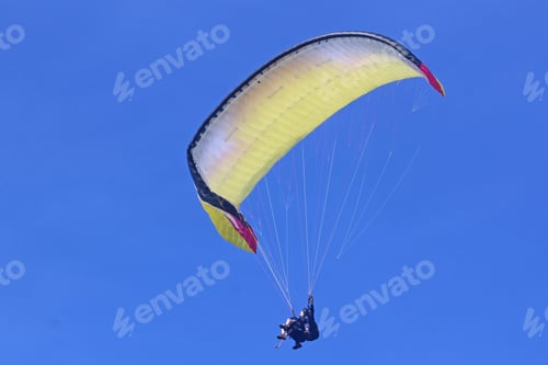 Preview: Tandem Paraglider Flying Yellow Wing Under Big Ears