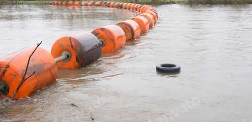 Preview: A Car Tyre Floating Adrift Downstream In River Flood Water