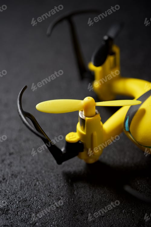 Preview: Yellow Drone On A Black Table.