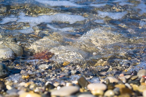Preview: Sea Pebble Beach With Multicoloured Stones, Transparent Waves With Foam, On A Warm Summer Day