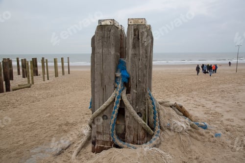 Preview: Still Life On The Beach With Old Mooring Wrapped With Worn Anchor Ropes