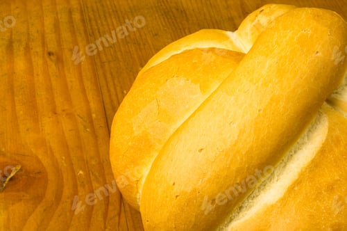 Preview: Fresh Braided Loaf Of White Wheat Bread On Wooden Background