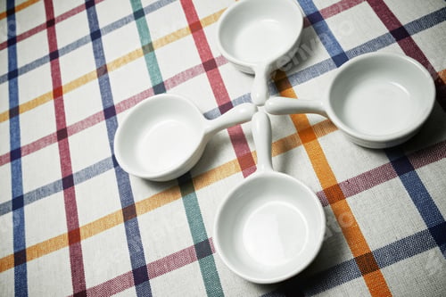 Preview: Small White Spoons On A White Tablecloth