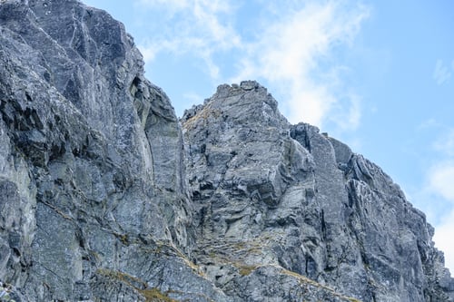 Preview: Rocky Mountain Peak Area View In Slovakia. Bright Sunlight And White Clouds On Blue Sky Covering