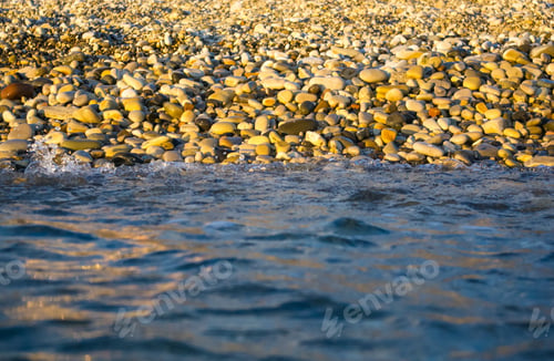 Preview: Sea Pebble Beach With Multicoloured Stones, Transparent Waves With Foam, On A Warm Summer Day