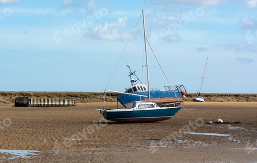 Preview: Small Boats Stranded At Low Tide At Wells Next The Sea, Norfolk, Uk