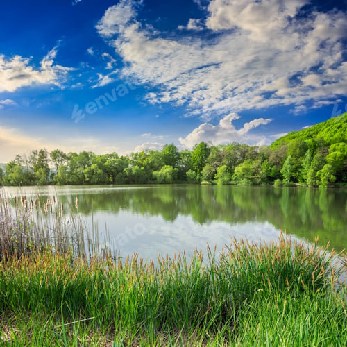 Preview: View On Lake Near The Forest On Mountain Background At Sunrise