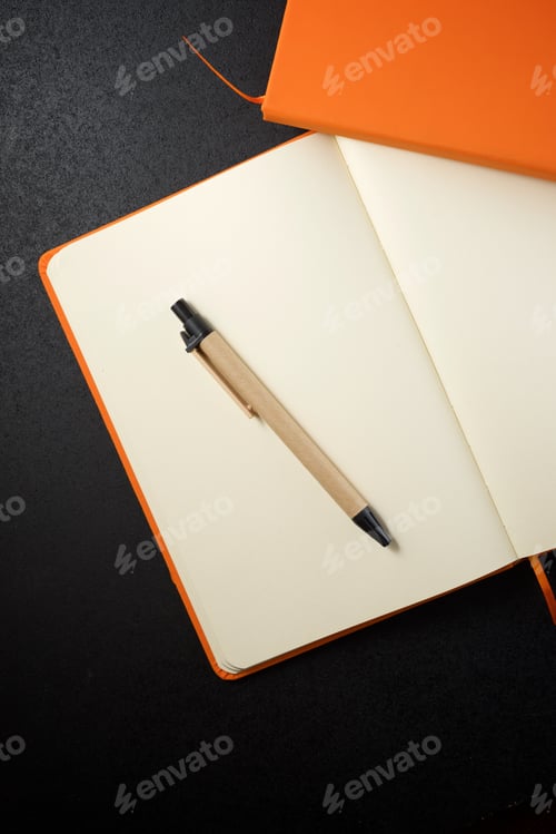 Preview: Notebooks View On A Black Table.