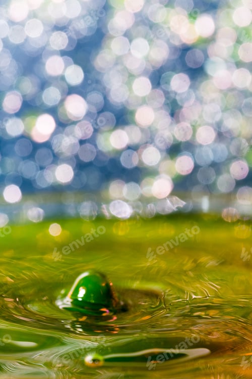 Preview: Abstract, Colorful Composition With Small Bokeh Lights And Water Texture. Can Be Used As Christmas