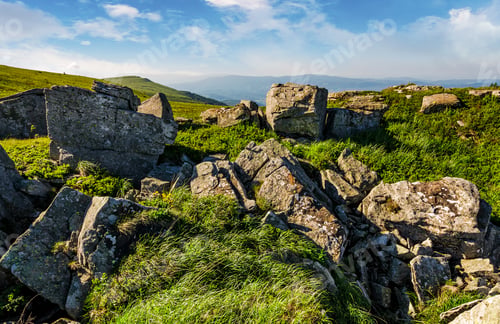 Preview: Huge Boulders On A Grassy Hillside At Sunrise. Gorgeous Mountain Landscape With Beautiful Sky