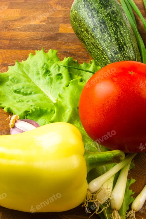 Preview: Still Life - Green Onion, Yellow Peppers. Zucchini, Tomato, Garlic And Lettuce On Wooden Board