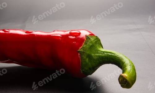 Preview: Red Chili Pepper On A Black Background
