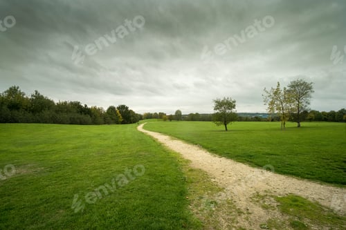 Preview: Dirt Track Leading Across A Park