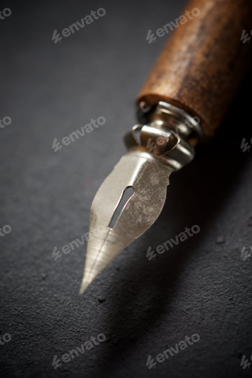 Preview: Nib Pen For Calligraphy On A Black Table.