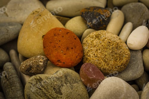 Preview: Boulders And Colorful Pebbles On The Beach