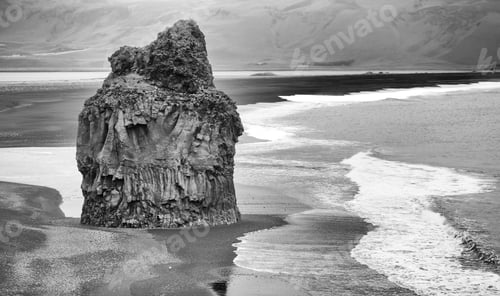 Preview: The Sea Stack And Black Sand Beach At Dyrholaey, Southern Iceland. A High Contrast Monochrome Edit.