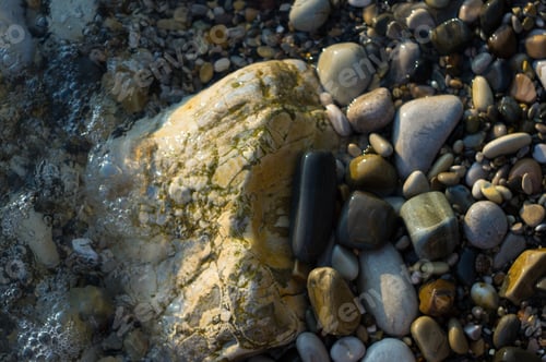 Preview: Pebble Stones On The Sea Beach, The Rolling Waves Of The Sea With Foam