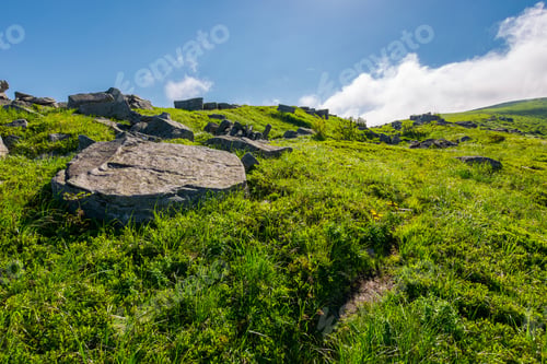 Preview: Cloud Over The Grassy Hillside With Rocks. Path Uphill In To The Sky. Lovely Summer Scenery