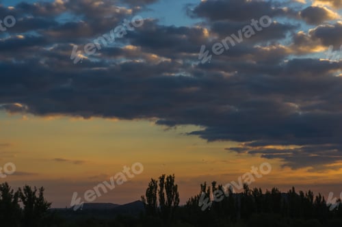 Preview: Landscape With Dramatic Light - Orange Clouds And The Outline Of Trees At Sunrise