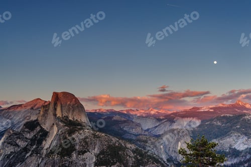 Preview: A Panoramic View Of Half Dome And Yosemite Valley. Golden Light From The Sunset Is Cast Upon The