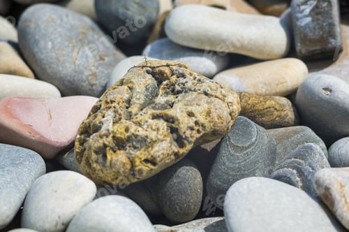 Preview: Boulders And Colorful Pebbles On The Beach