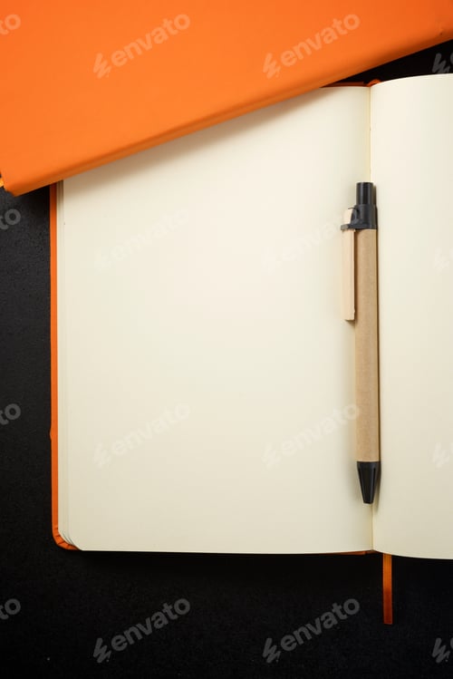 Preview: Notebooks View On A Black Table.