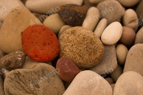 Preview: Boulders And Colorful Pebbles On The Beach