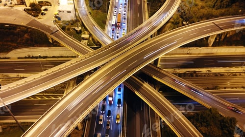 Preview: Aerial Drone Slow Shutter Night Shot Of Urban Elevated Toll Ring Road Junction And Interchange