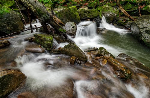 Preview: Small Cascades On The Forest River Among Huge Boulders Covered With Moss. Fresh And Clean Nature