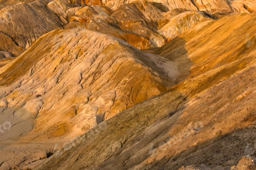 Preview: Orange Clay Hills In The Desert, Lit By The Setting Sun