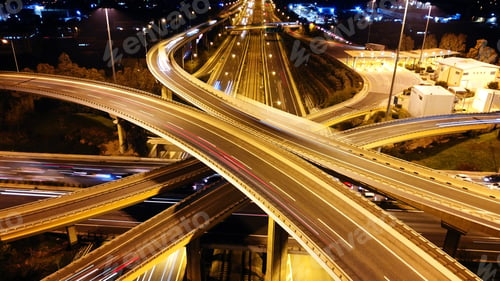 Preview: Aerial Drone Slow Shutter Night Shot Of Urban Elevated Toll Road Junction And Interchange Overpass
