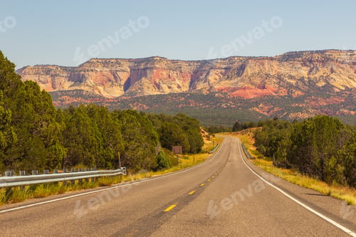 Preview: A Highway Runs Along The Red-Sandstone. Empty Road In Arizona, Usa.