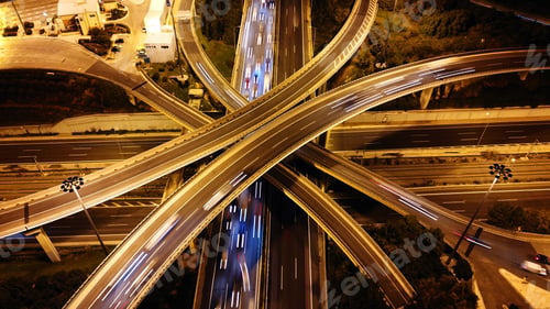 Preview: Aerial Drone Slow Shutter Night Shot Of Urban Elevated Toll Road Junction And Interchange Overpass