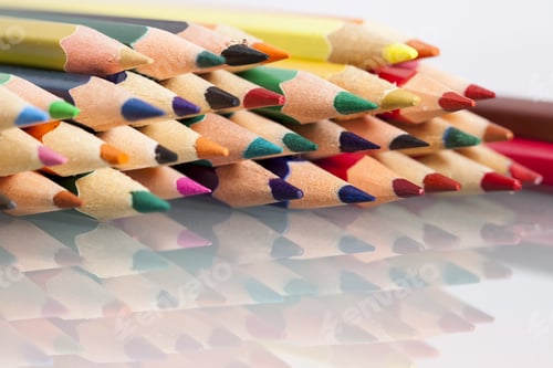 Preview: Group Of Sharp Colored Pencils With White Background And Reflexions