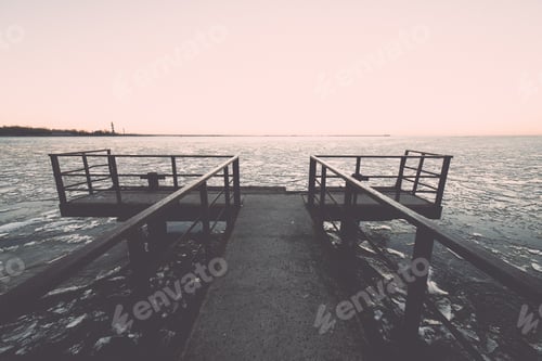 Preview: Sunset Over Frozen Sea With Ice Blocks And Dramatic Colorful Sky With Old Metal Bridge - Vintage