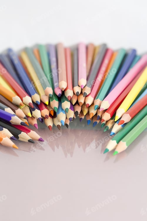 Preview: Group Of Sharp Colored Pencils With White Background And Reflexions