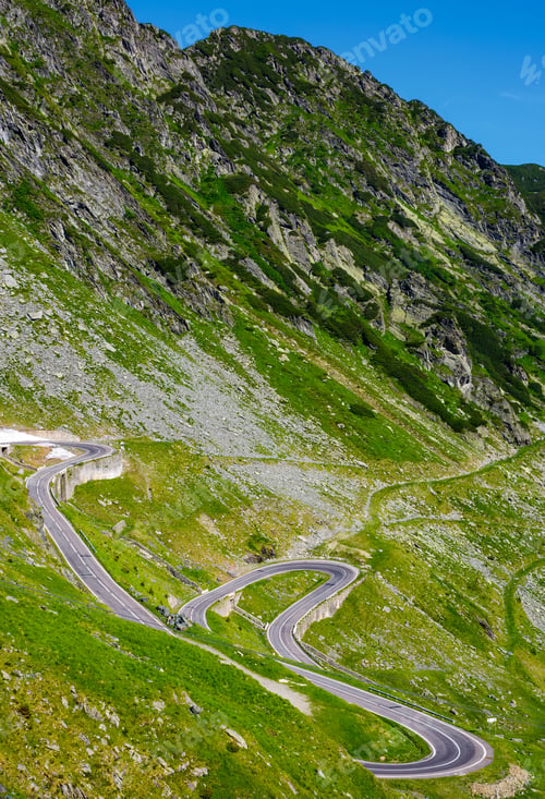 Preview: Serpentine Road In Fagarasan Mountains. Lovely Transportation Background. Popular Tourist