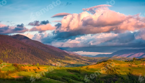 Preview: Countryside Landscape In Mountains At Sunset. Grassy Meadow On A Hill Behind The Fence. Spectacular