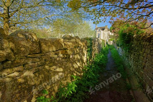 Preview: A Public Footpath Running Through The Heart Of The Village Of Painswick Bathed In Early Morning