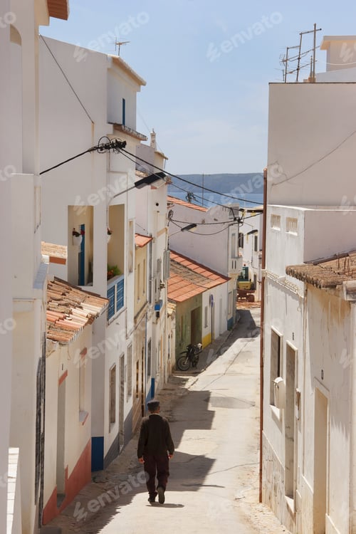 Preview: Fisherman Walking Down In Coastal Village Street