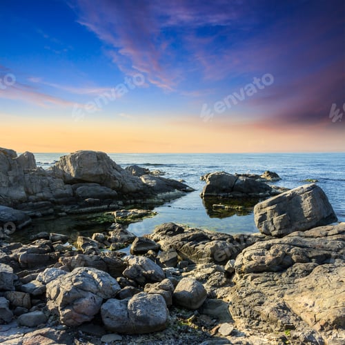 Preview: Calm Sea Wave On Rocky Shore With Boulders