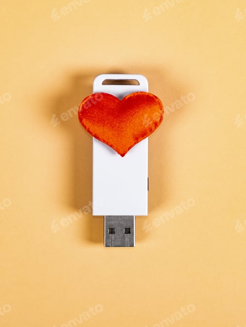 Preview: Usb Flash Drive With A Heart Shape On The Paper Background Closeup