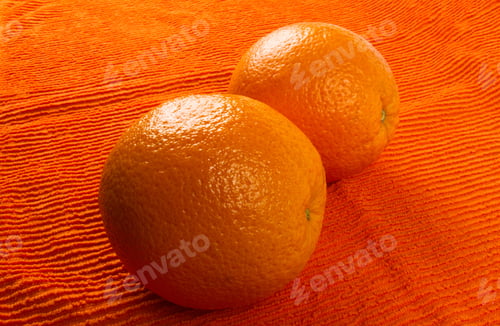 Preview: Two Orange On The Textile Orange Background